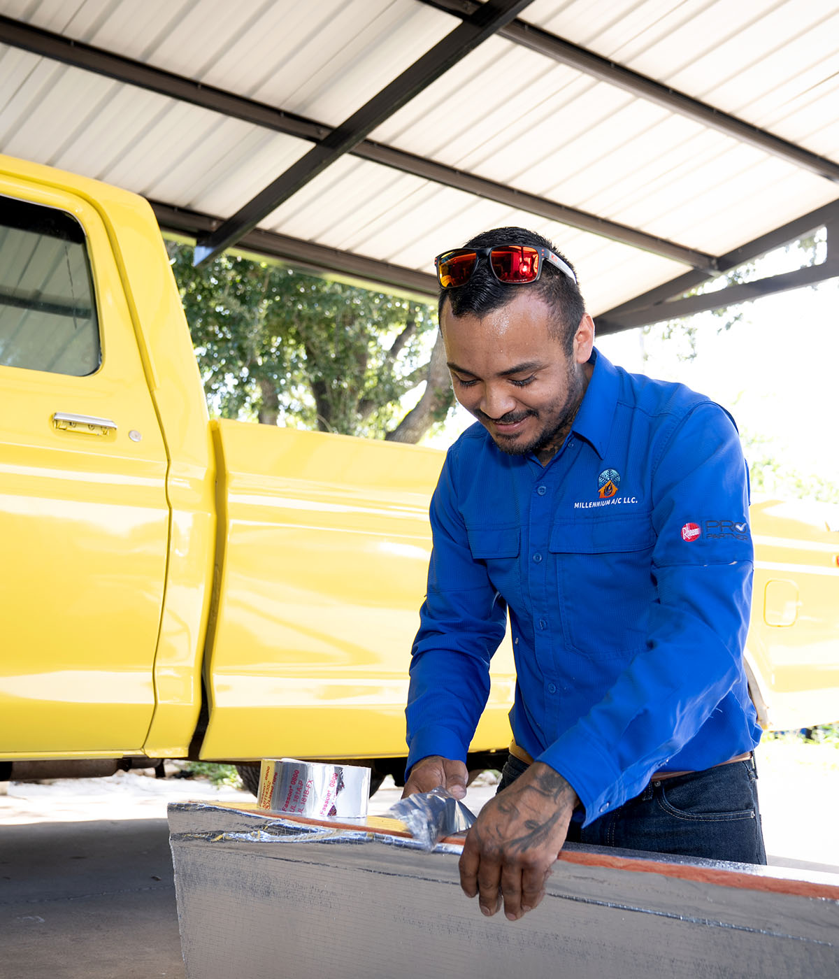 Millennium's technician cutting insulation board