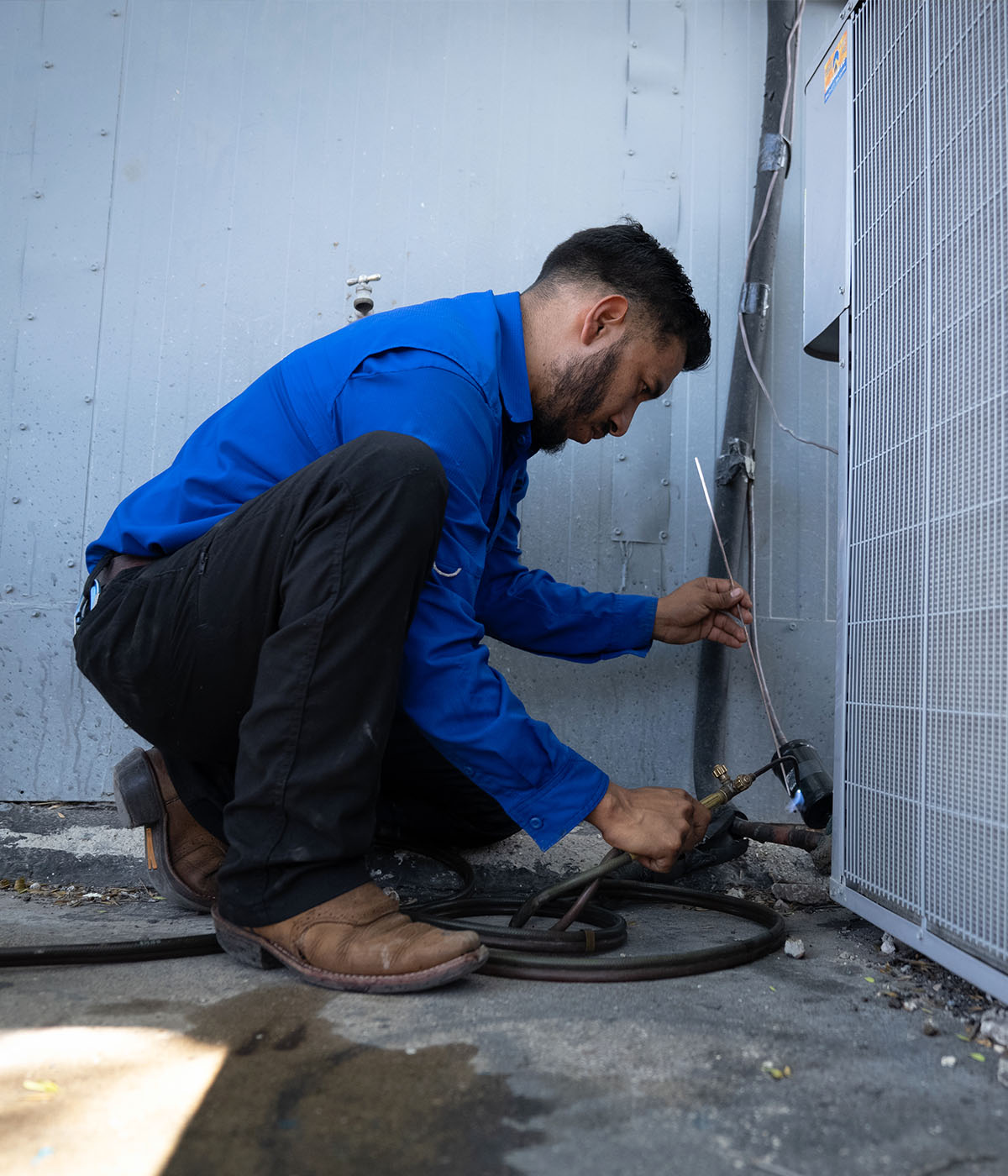 technician installing ac unit